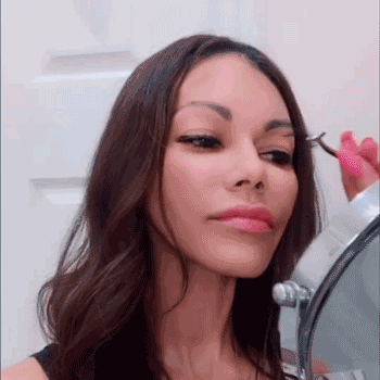 Using an eyelash applicator or carefully with tweezers, while final coat of eyeliner is tacky, place each eyelash on top of the magnetic liner (not too close to the inner eye). The lashes will softly click onto the liner.